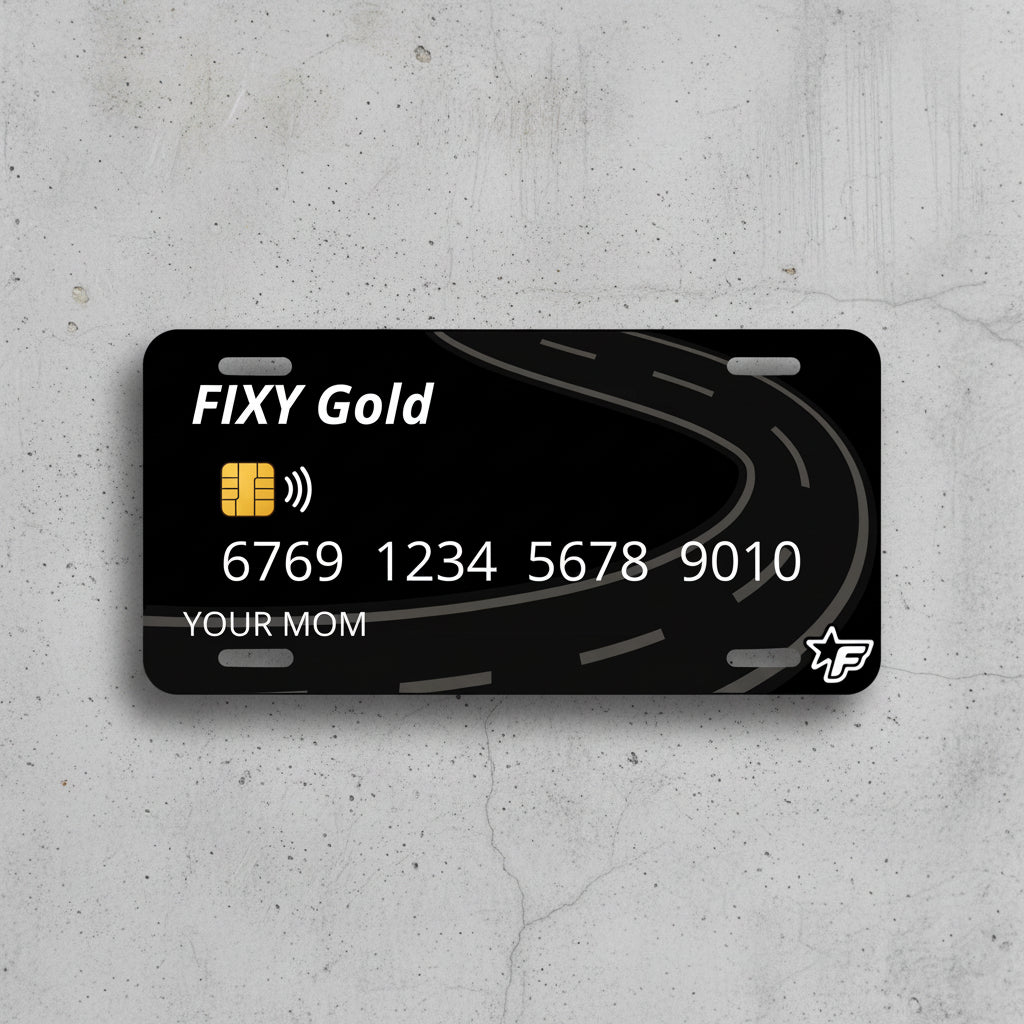 Black license plate with FIXY Gold branding and road design on a white background