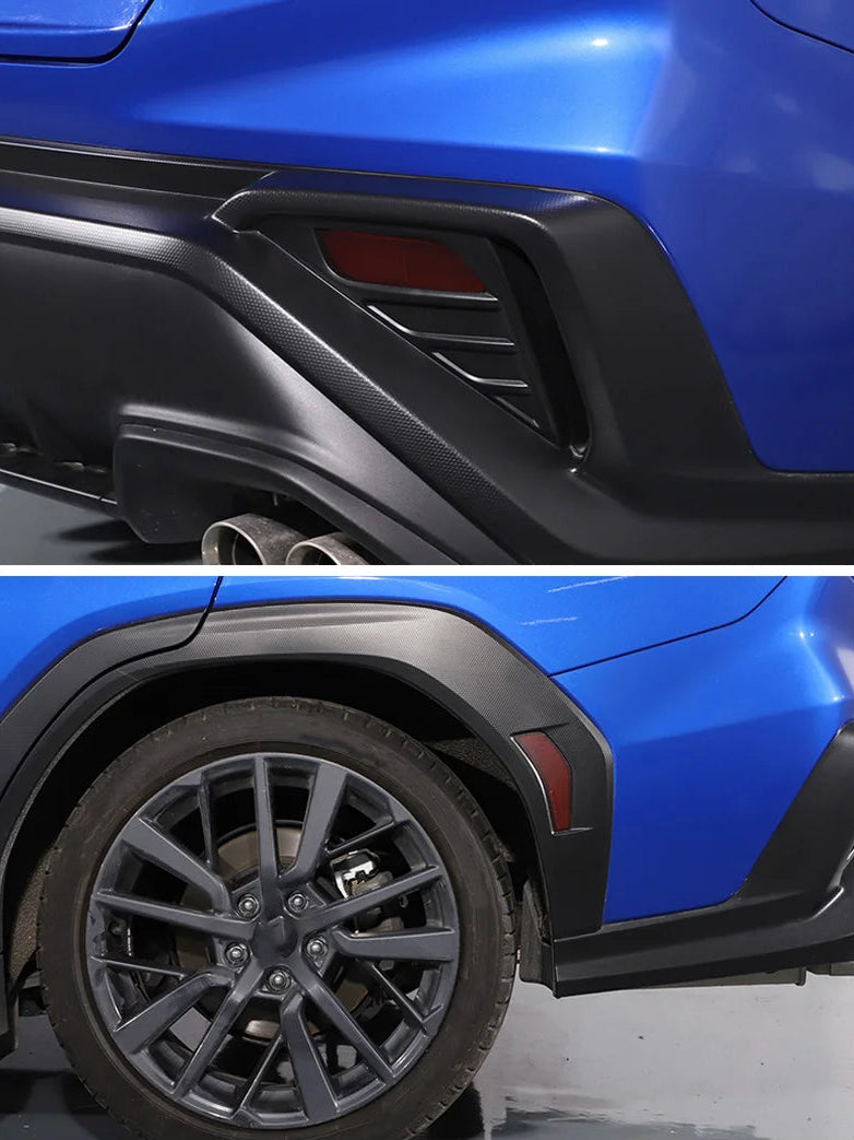 Close-up of a blue car with black rear bumper and wheel well trim.