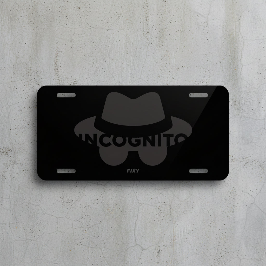 Black license plate with a bow tie design and 'Incognito' text on a white background