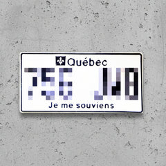 A Quebec novelty license plate sticker or decal with a white background, black border, the word 'Québec' and a fleur-de-lis, pixelated numbers, and the text 'Je me souviens' at the bottom.