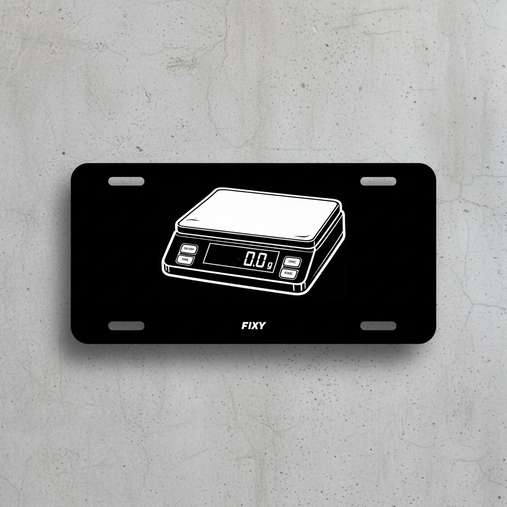 Black license plate with white outline of a digital scale and 'FIXY' branding on a white background