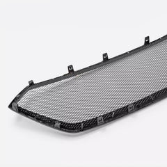 Car grille with black mesh on a white background