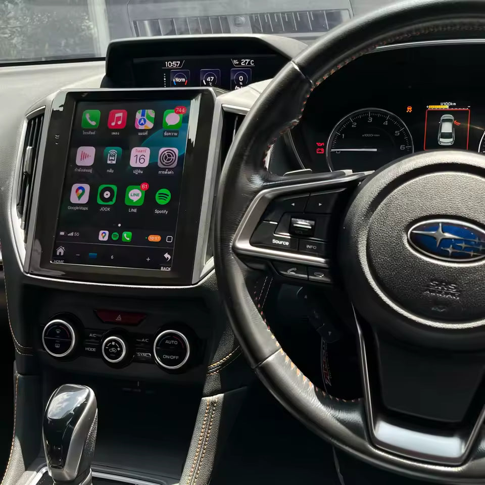 Car interior with touchscreen display and steering wheel featuring Ford logo