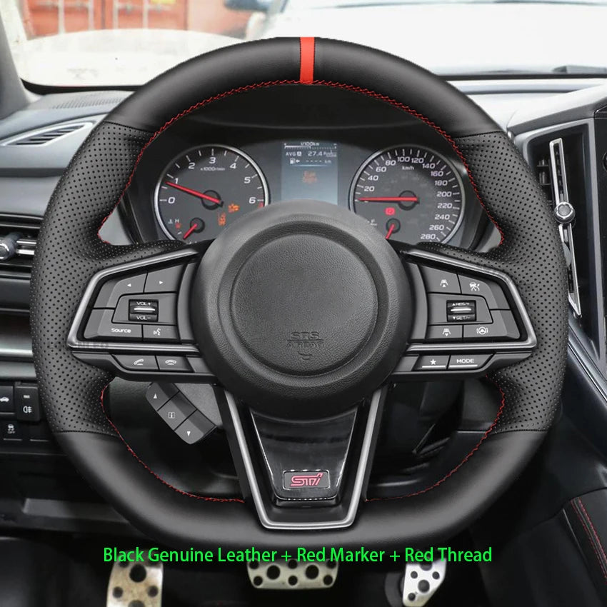 Car steering wheel with black genuine leather, red marker, and red thread, displayed in a car interior.
