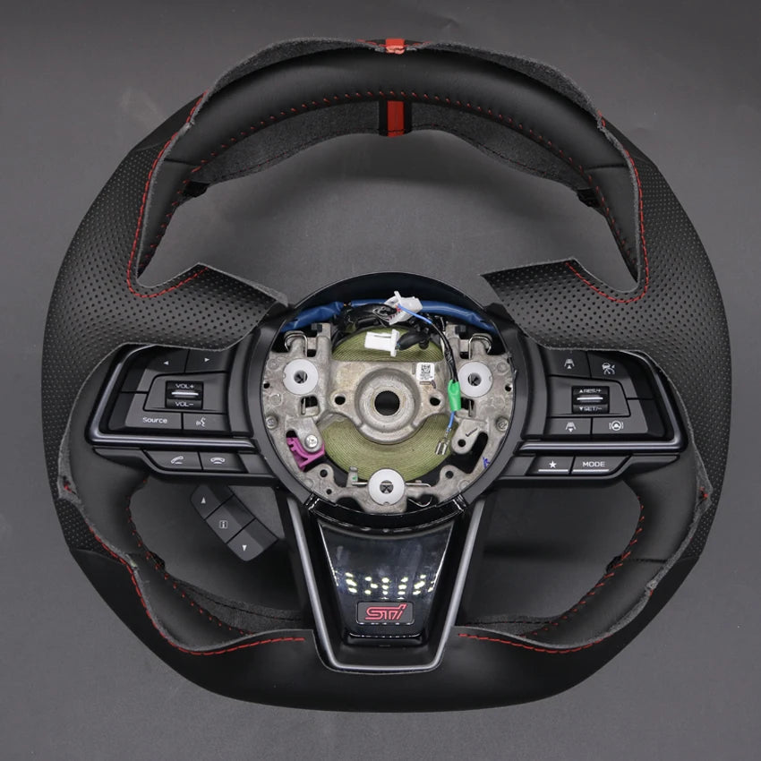 Car steering wheel with visible brand logo on a gray background