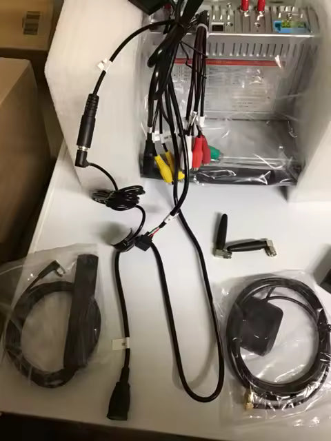 Electrical components including wires and connectors on a white surface