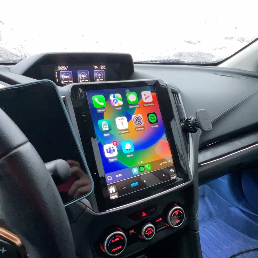 Car dashboard with a tablet mounted on a holder displaying app icons.
