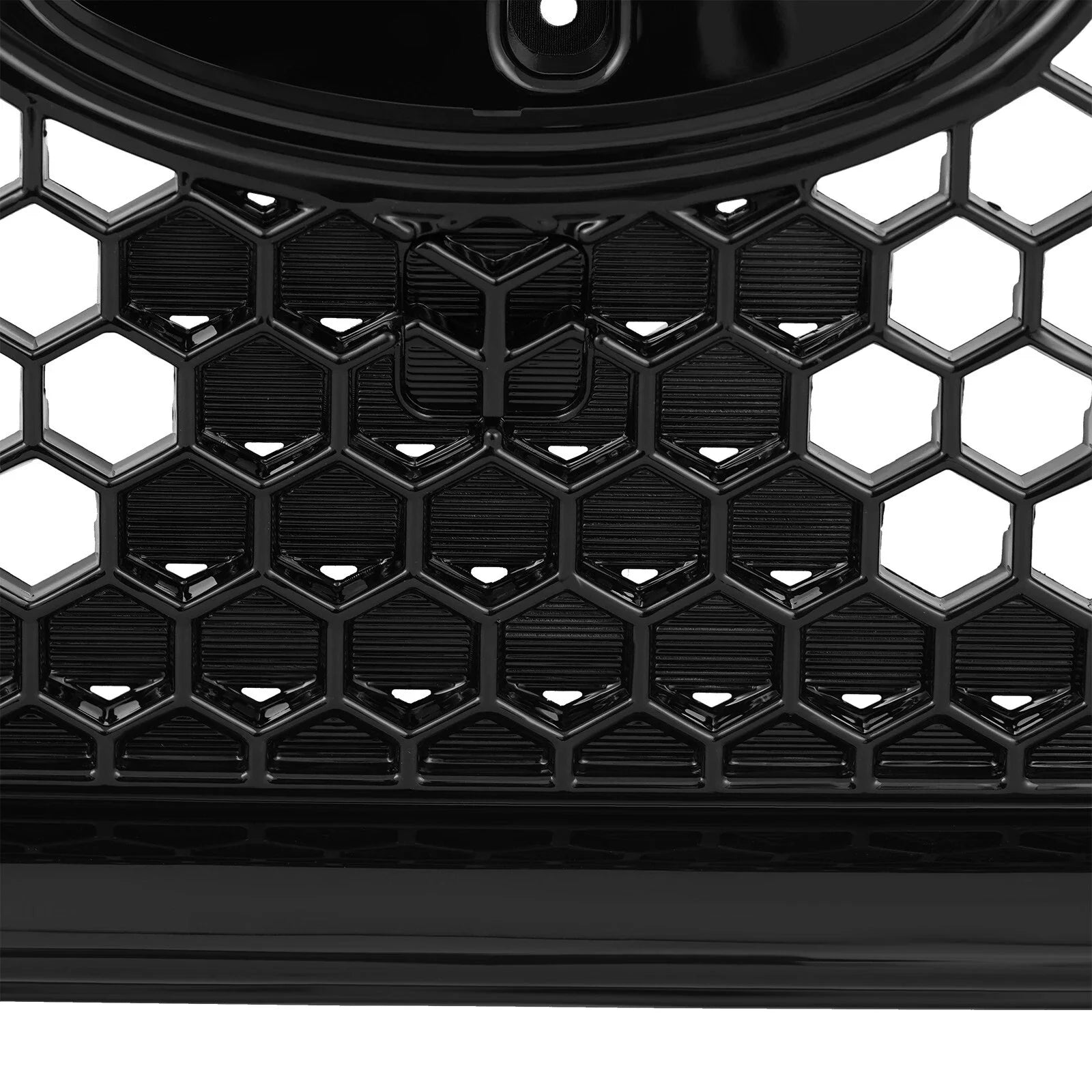 Black honeycomb grille with a brand logo on a white background