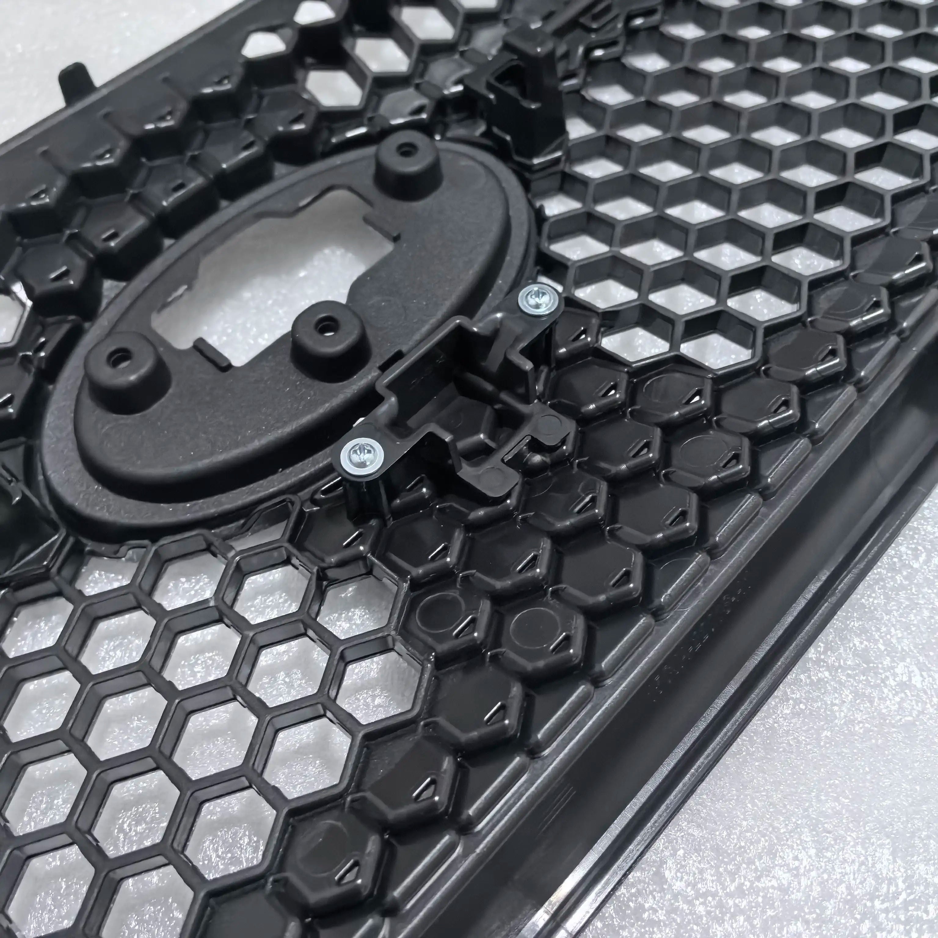 Close-up of a black and gray honeycomb-patterned product