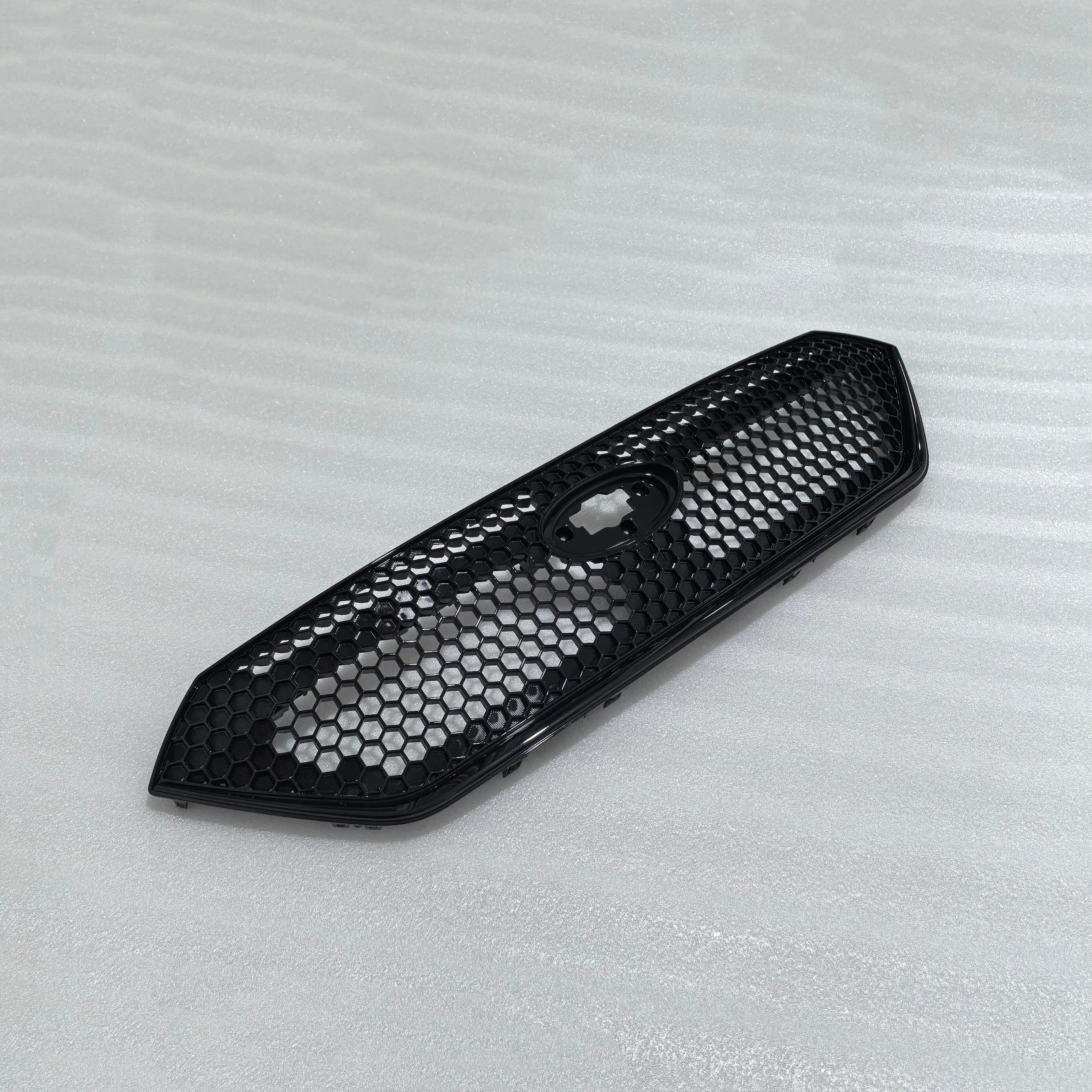 Black honeycomb grille on a light gray background