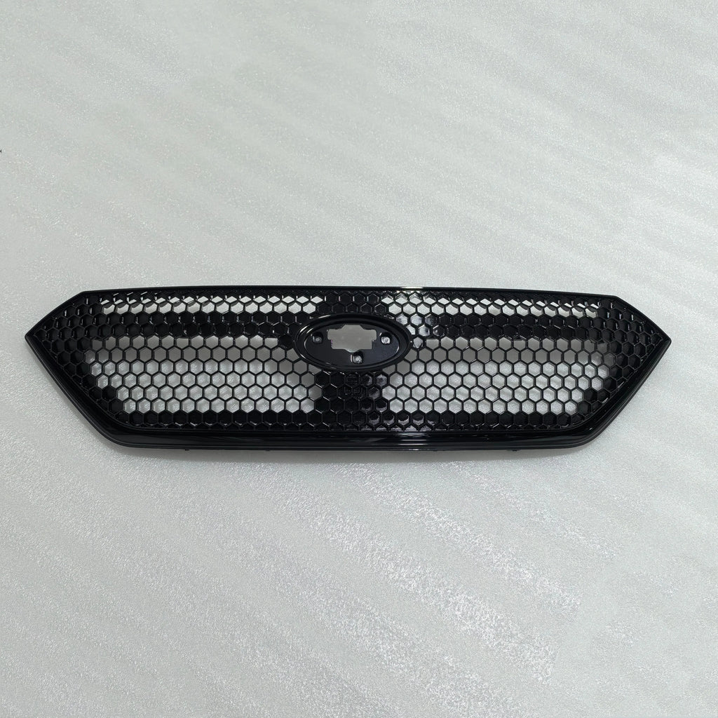 Black honeycomb car grille on a light gray background