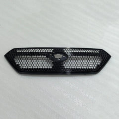Black honeycomb car grille on a light gray background