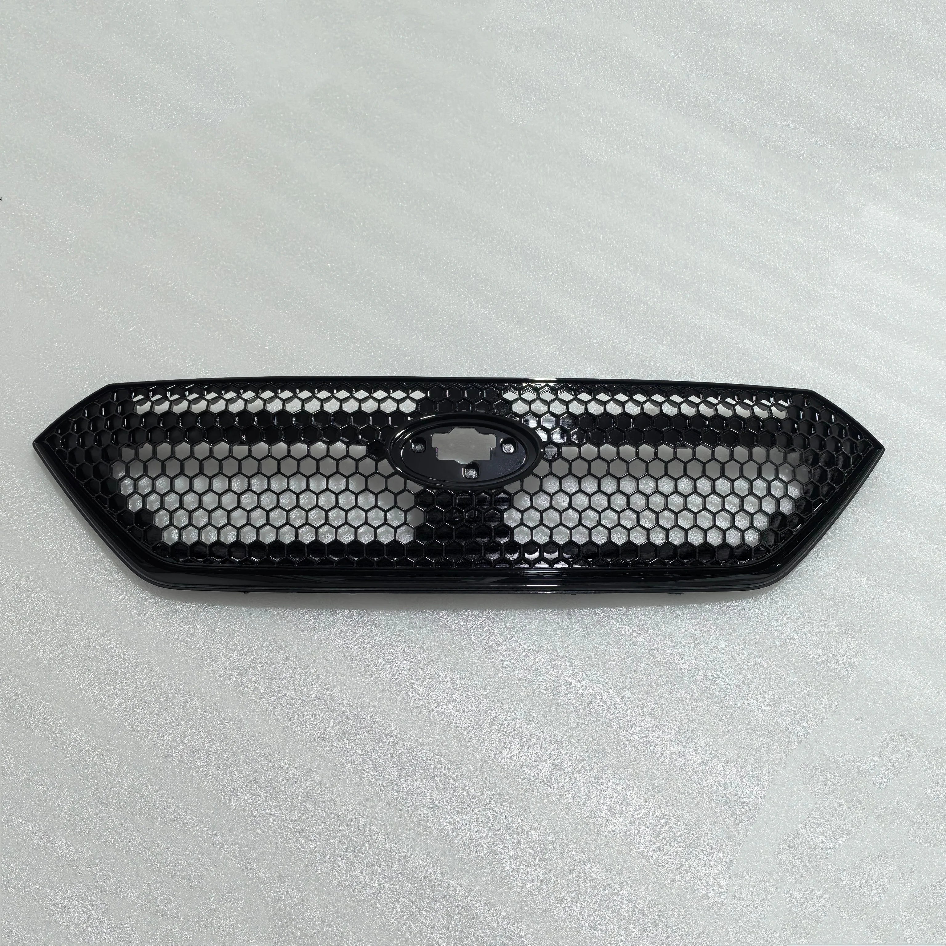 Black honeycomb car grille on a light gray background