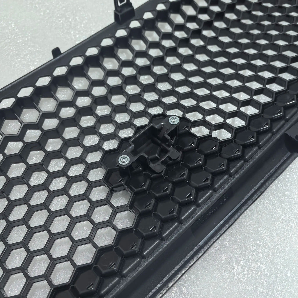 Black honeycomb patterned tray on a gray surface