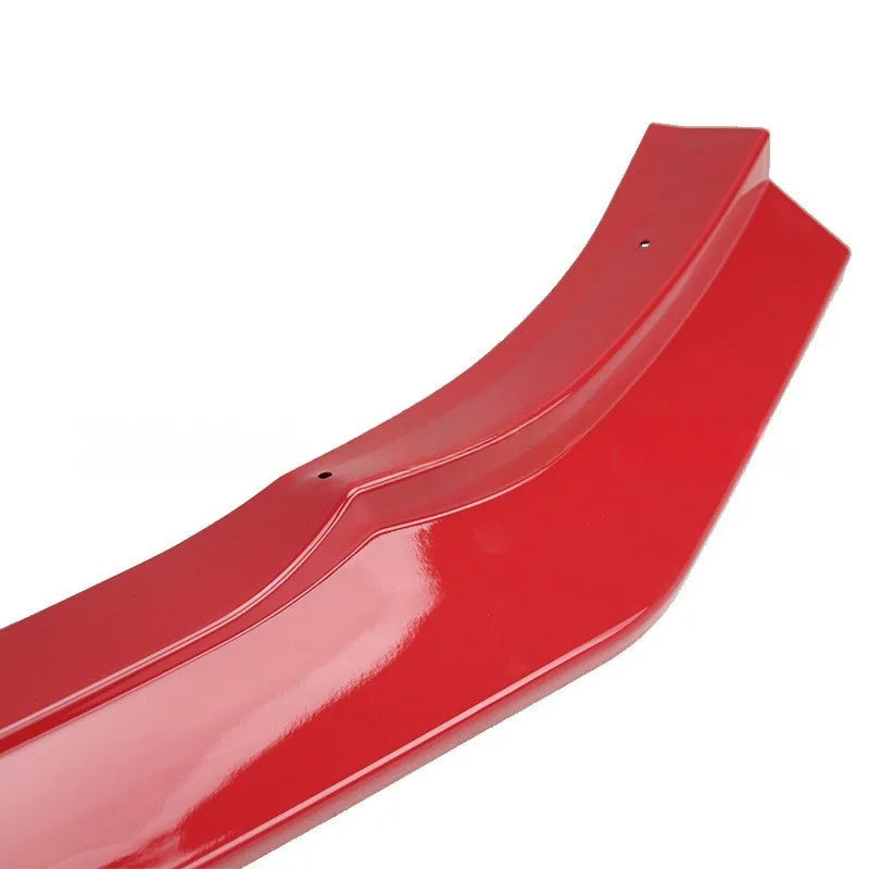 A glossy red automotive bumper lip or lip spoiler trim piece shown on a plain white background.