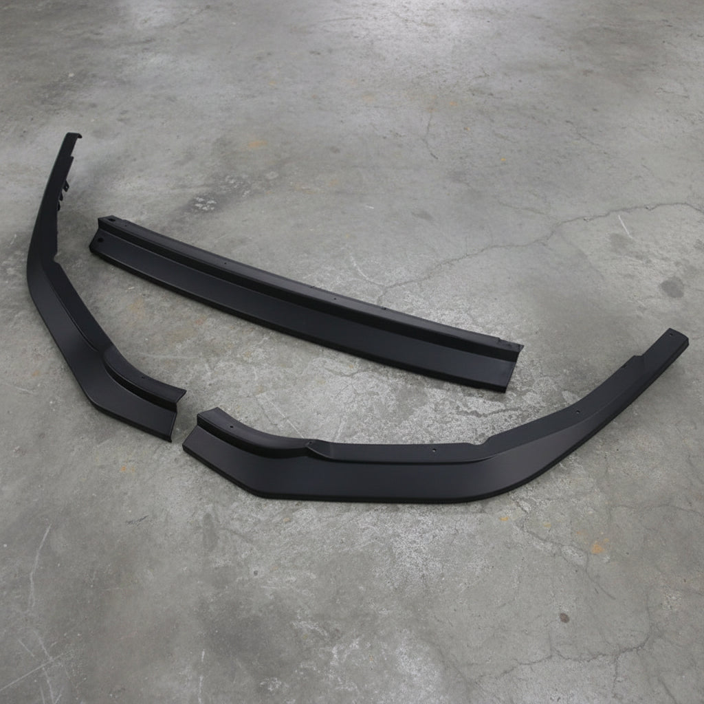A pair of black plastic automotive body trim pieces, likely bumper or fender trim, displayed on a clean white background.